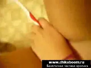 the girl takes off herself naked and at this time puts a toothbrush in her pussy