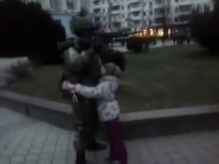 russian soldier and local teen in crimea